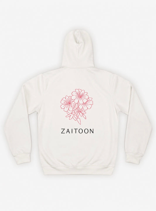 White hoodie with pink floral design and 'Zaitoon' text on a white background