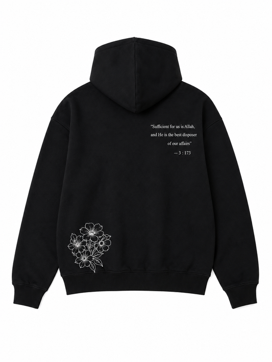 Black hoodie with floral design and text on the back against a white background